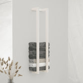 White solid pine wood towel rack holding stacked gray and white towels.