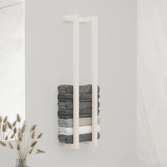 White solid pine wood towel rack holding stacked gray and white towels.