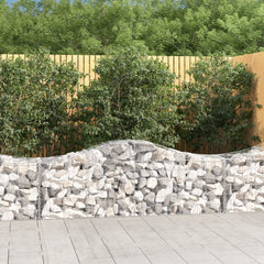 Four galvanized iron arched gabion baskets for creating a durable garden wall.