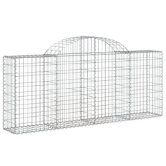 Set of 4 galvanized iron arched gabion baskets for garden walls, filled with rocks or gravel.