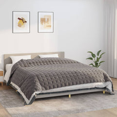 Gray Bostome weighted blanket on a bed, measuring 86.6x102.4 inches and weighing 33.1 pounds.