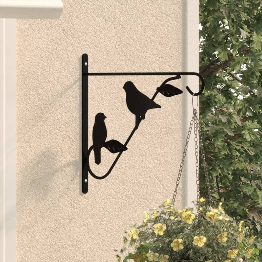 Black powder-coated steel hanging basket bracket with bird design mounted on wall