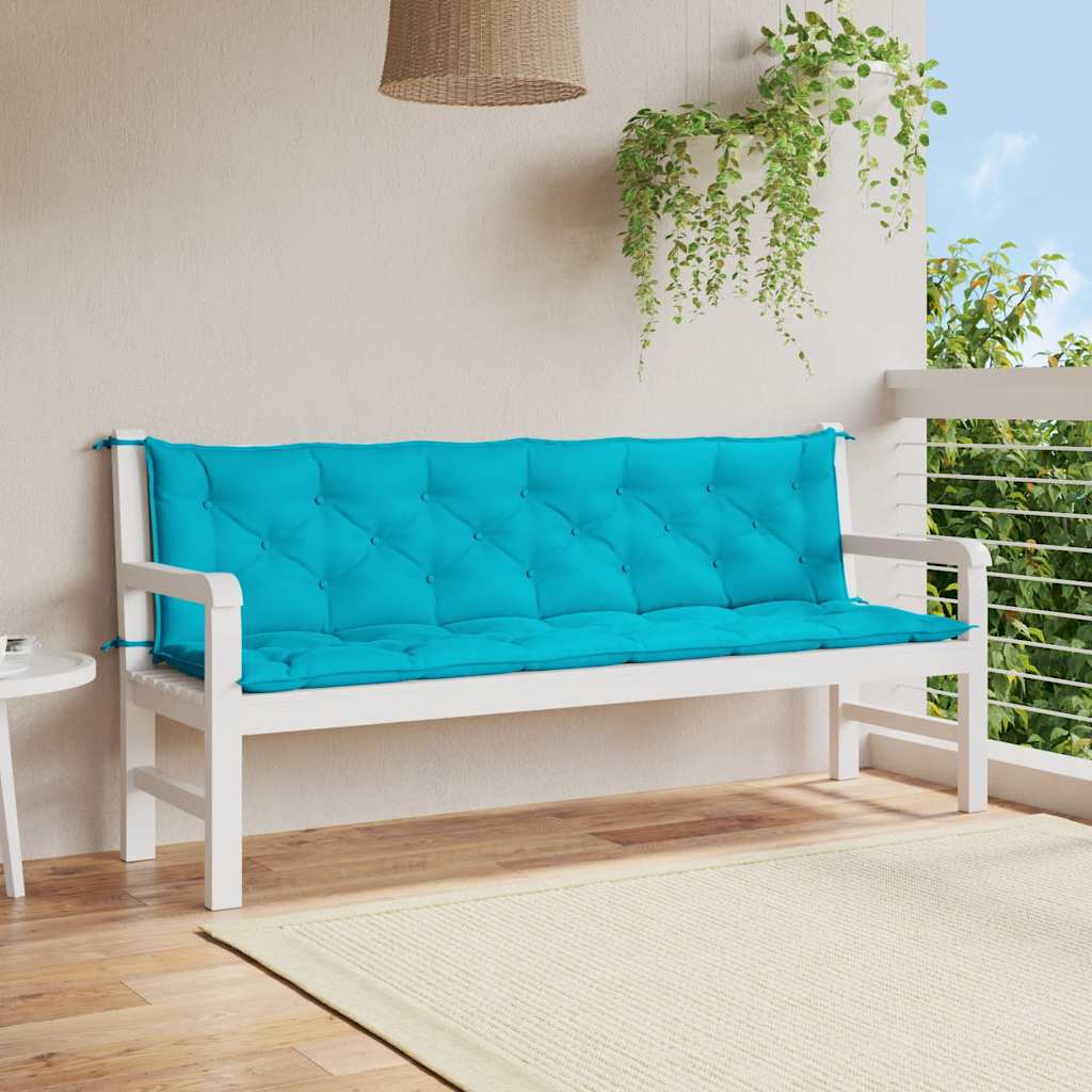 Turquoise outdoor bench cushions with water-repellent fabric and non-slip ties.