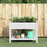White polypropylene raised garden bed with shelf and self-watering system for easy plant care.