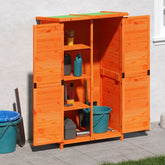 Brown solid pine garden tool shed with open orange doors, shelves, and buckets on a patio.