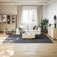 Anthracite shaggy polyester rug in 8'x10' size on a light wood floor in a modern living room.