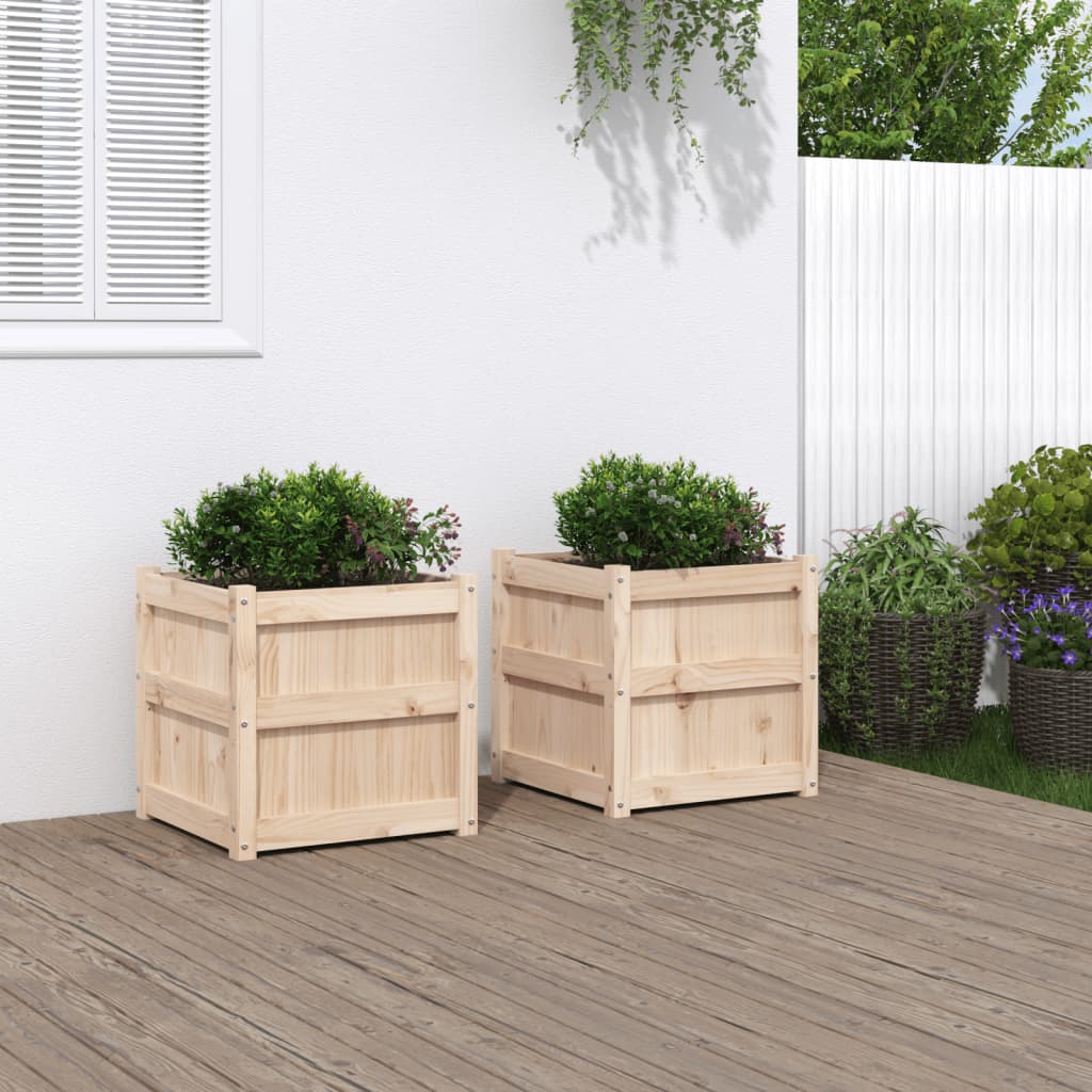 Two 19.7-inch square solid pine wood planters with boxwood shrubs on a wooden deck.