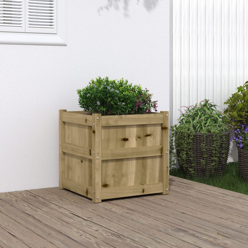 Square wooden garden planter made of impregnated pine, measuring 19.7 inches, with a bush inside on a deck.