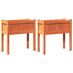 Two elevated brown pine wood garden planters with legs, shown as a pair.