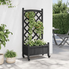 Black fir wood planter with integrated trellis, white flowers, and wheels on a patio.