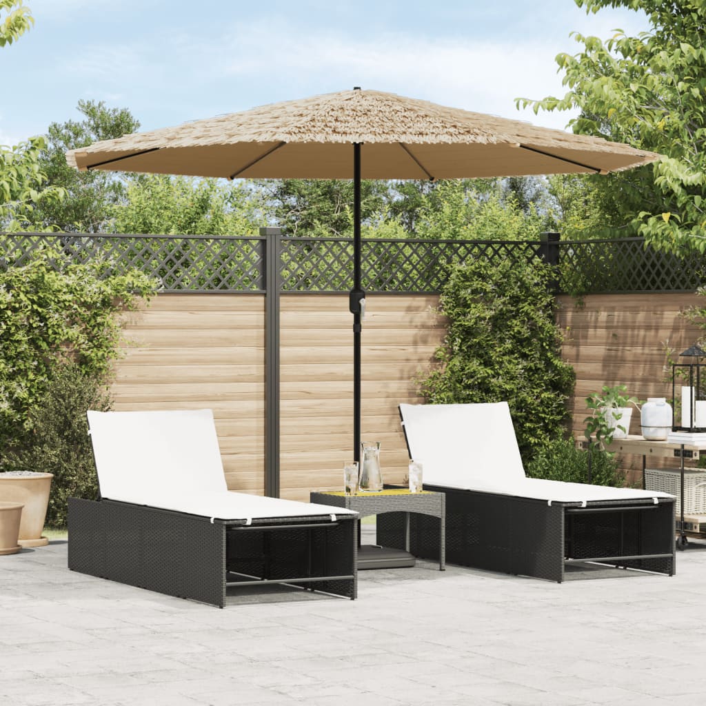 Brown garden parasol with steel pole open over two black lounge chairs on a patio.