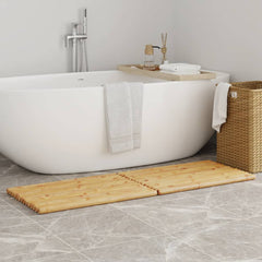 Two-piece set of natural bamboo bath mats, each 27.6 by 19.7 inches, placed beside a white bathtub.