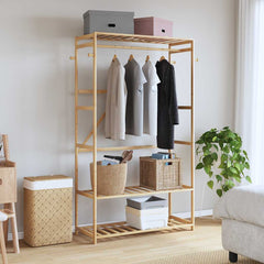Bostome bamboo clothes rack with three shelves, hanging rod, and four side hooks in natural wood.