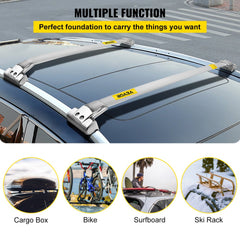 Silver stainless steel roof rack cross bars mounted on a Jeep Grand Cherokee, shown carrying cargo box, bike, surfboard, and skis.