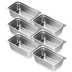 Six full-size stainless steel steam table pans, 6 inches deep, arranged in a stack.