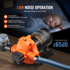 Orange 12V diaphragm water pump with plastic housing, pressure switch, hoses, and low noise features displayed.