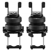 Pair of black air bag suspension units with mounting brackets for trucks.