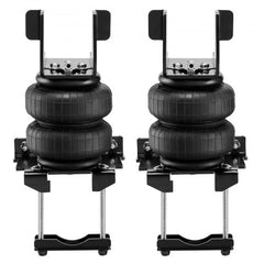 Pair of black air bag suspension units with mounting brackets for trucks.