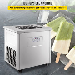 Stainless steel commercial popsicle machine with 40-piece set on gray surface, showing green and white popsicles.