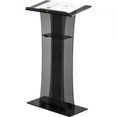 Clear acrylic pulpit with black accents, slanted reading surface, and storage shelf on a 47-inch stand.
