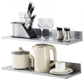 Stainless steel wall shelf with a brushed finish, 30" x 8.6", and L-shaped design for storage.