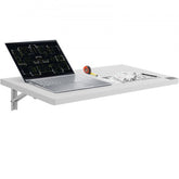 White wall-mounted folding table, 31.5 by 15.75 inches, with open laptop and blueprints.