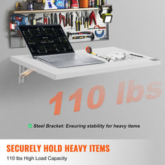 White wall-mounted folding table, 31.5 by 15.75 inches, with 110 lbs capacity and steel brackets.