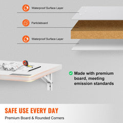 White wall-mounted folding drop leaf table, 47.24 inches wide, with layered particleboard construction and rounded corners.