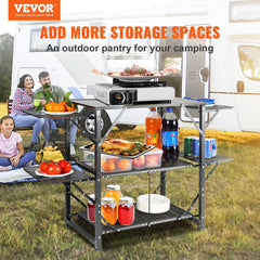 Folding aluminum camping kitchen table with shelves, side tables, and storage bag.