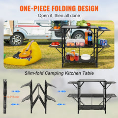 Folding aluminum camping kitchen table with shelves, side tables, and carry bag.
