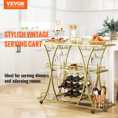 Gold 3-tier serving cart with wine rack, glass holder, and swivel casters for easy mobility.