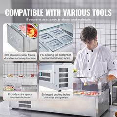 Countertop refrigerated condiment prep station with glass guard and modular tray system.