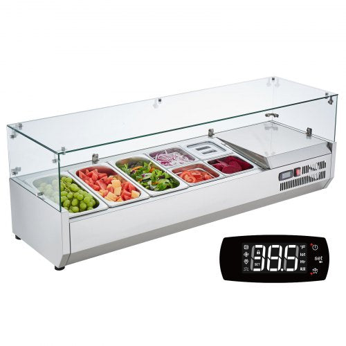 Refrigerated stainless steel condiment prep station with glass guard and assorted vegetable pans.