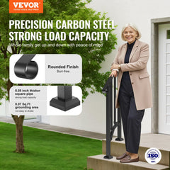 A smiling woman stands next to a black carbon steel handrail with a rounded finish and thick square pipe.