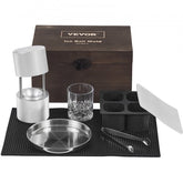 A Bostome ice ball press kit with aluminum components and tools for making ice spheres.