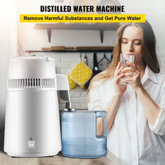 White stainless steel 4L water distiller on kitchen counter with blue collection bottle and woman drinking from glass.