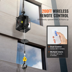 Electric hoist winch with 200 ft wireless remote, mounted on building lifting load.