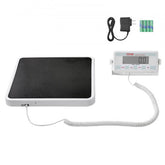 Portable digital physician scale with 550 lb capacity, anti-slip mat, LCD display, and power adapter.