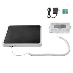 Portable digital physician scale with 550 lb capacity, anti-slip mat, LCD display, and power adapter.