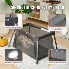 Dark gray folding baby travel crib play yard with a zipper gate and breathable mesh sides.