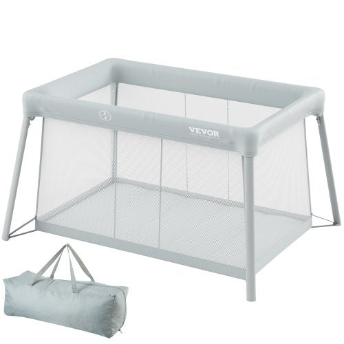 Gray foldable baby travel crib with mesh sides and carrying bag included
