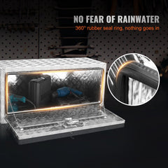 Silver aluminum underbody truck tool box, 36x14x16 inches, open with tools inside and 360-degree rubber seal detail.