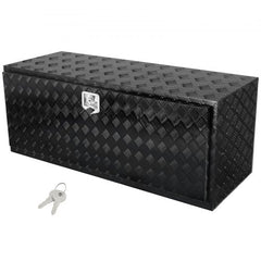 Black diamond-plate aluminum truck tool box, 60x24x24 inches, with key lock.