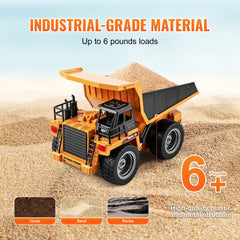 Orange 1:18 scale RC dump truck with 4WD, metal structure, and 6+ age rating on sand.