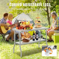 Stainless steel folding prep table with adjustable legs in a camping setup.