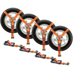 Four orange lasso-style car tie-down straps securing black car wheels, with ratchet buckles and hooks.