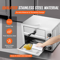 Stainless steel countertop pizza oven with crumb tray, timer, and easy-clean interior.