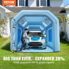 Inflatable blue paint booth with a car inside, set up in a driveway.