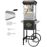 Black Bostome popcorn machine on cart with wheels, scoop, and measuring tools visible.