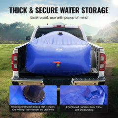 Blue collapsible PVC water storage bladder with reinforced seals and handles in a truck bed.